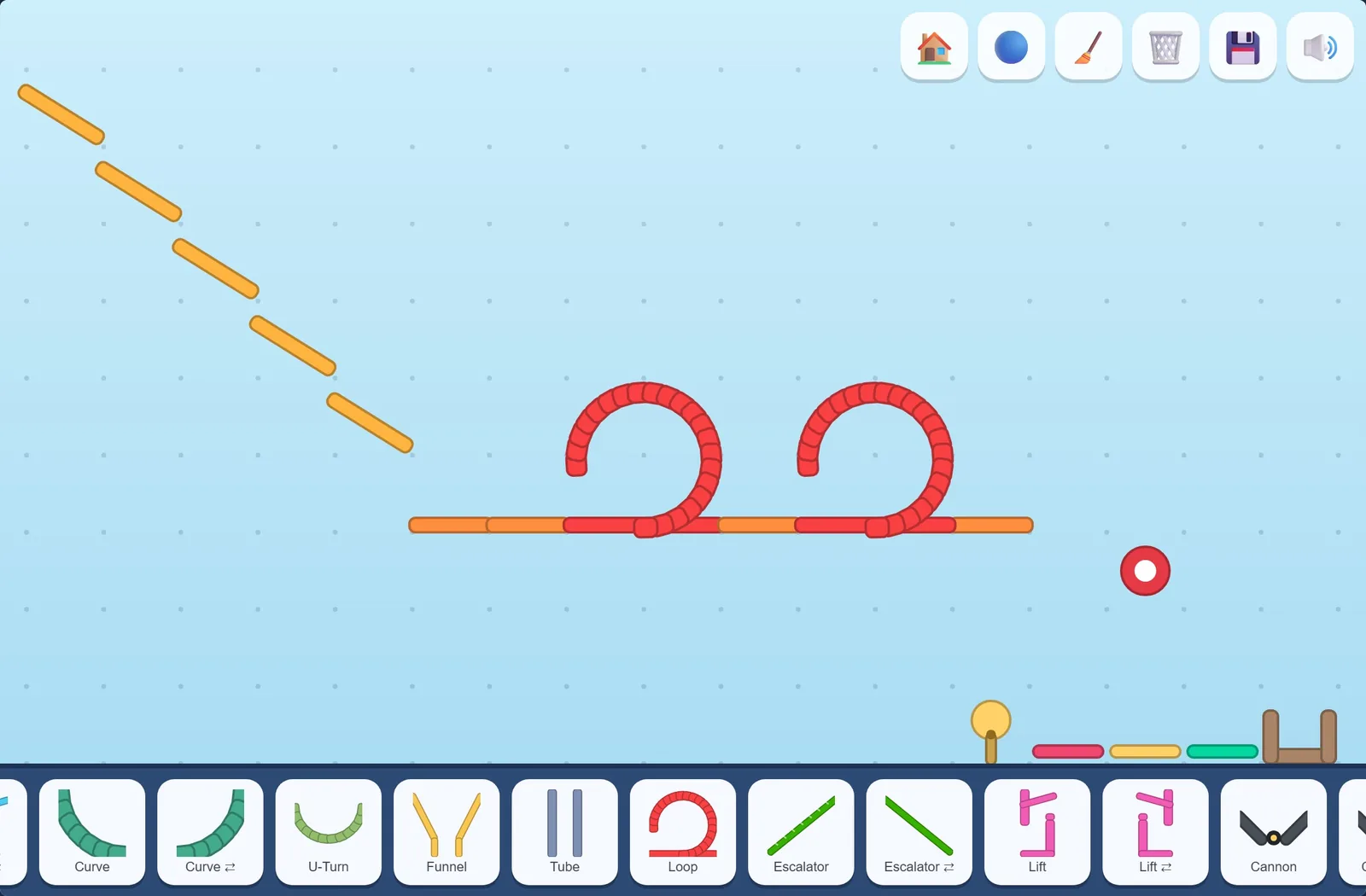 A course of ramps, straight track and two loops, finished with pieces dragged from the tray.