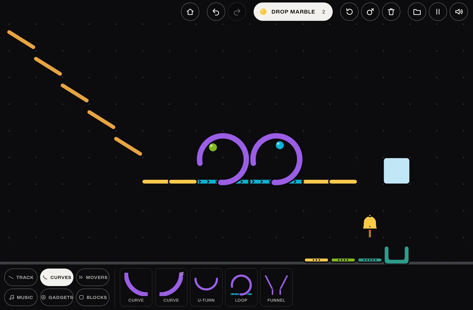 The new course with one marble climbing each of its two loops.