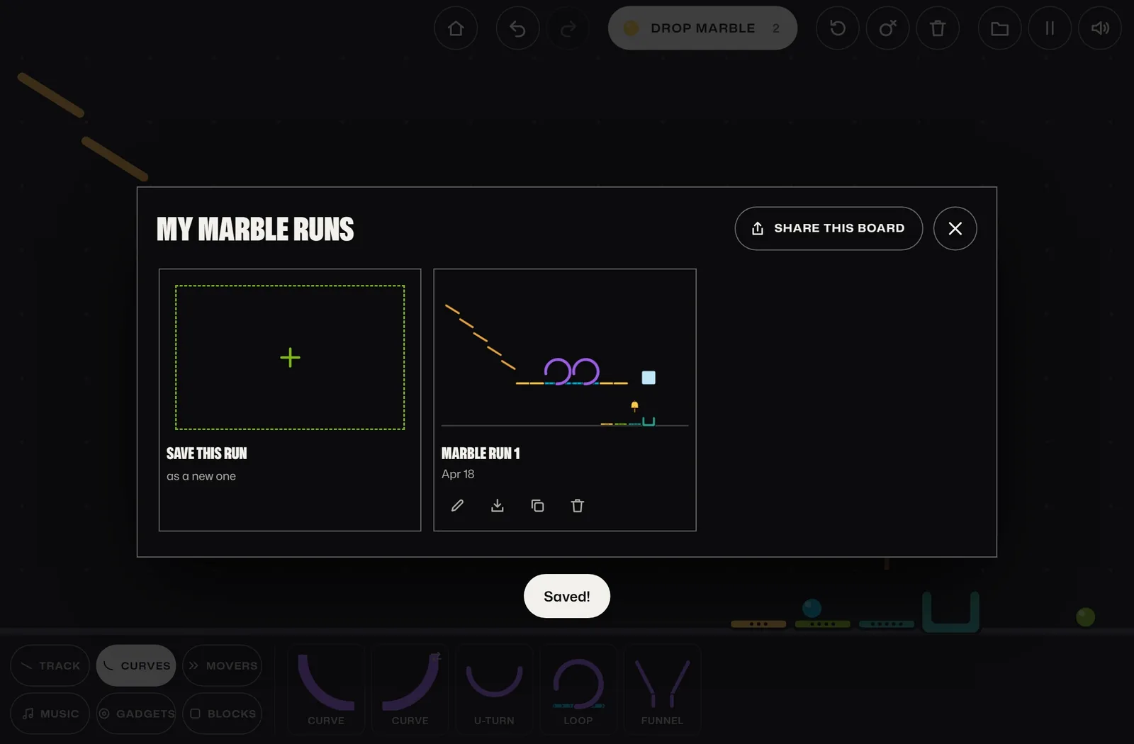 The My Marble Runs window with Marble Run 1 saved, its thumbnail and date, and a Saved! message.
