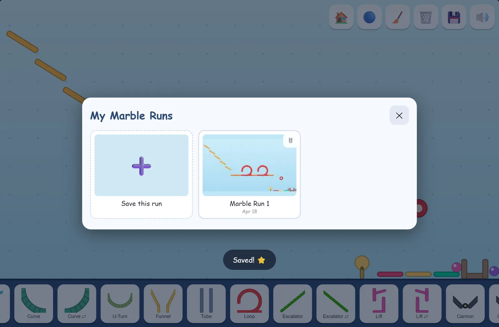 The My Marble Runs window with Marble Run 1 saved, its thumbnail and date, and a Saved! message.